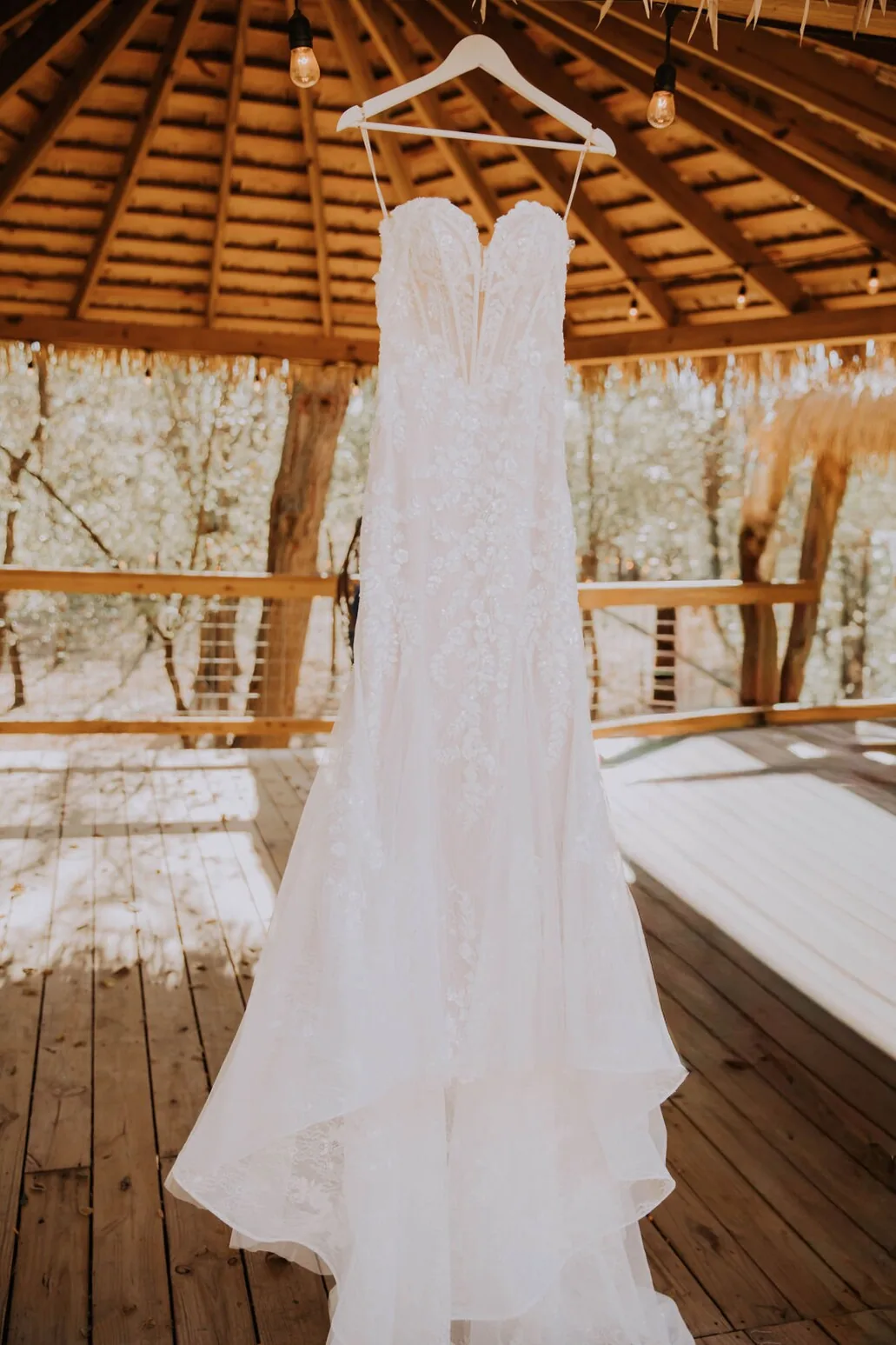 Wedding dress hanging in the gazebo